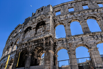 Fototapeta premium Pula, Croatia - 07 07 2022: Photography of ancient walls and architectural detail of arena in Pula from Roman period.