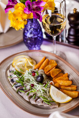 Herring fillet with potatoes and onions