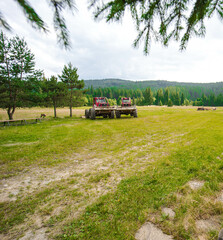Fototapeta premium Two tractors in a field