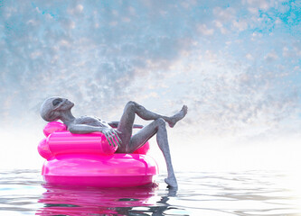 Alien grey relaxing on inflatable water seat.
