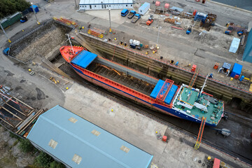 Fototapeta na wymiar Ship Building and Crane in Port Glasgow Ferguson Shipbuilding Scaffold Dock Harbor Harbour