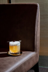 Cocktail with froth, ice and cherries