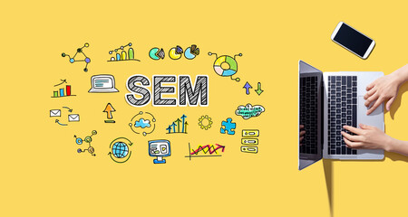 SEM with person working with laptop