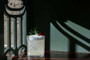 Cocktail with rosemary, olives and froth