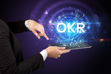 Close-up of a touchscreen with abbreviation.