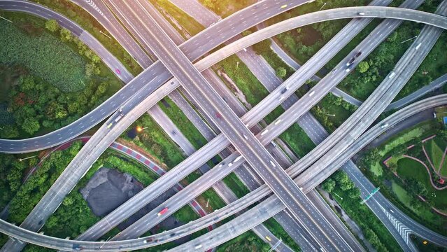 4K : Aerial view and top view of traffic on city. interchange and multi junction road with lots cars. Beautiful aerial top view from drone. traffic time lapse. Thailand.

