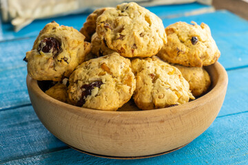 Shortbread cookies in a wooden plate on a blue background. food concept
