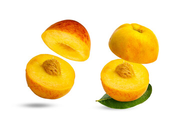 Concept of food levitation. Floating sliced peach fruit isolated on white.