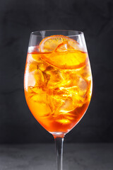 A cocktail with ice and an orange
