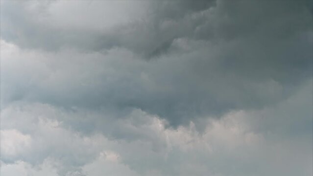 4k time lapse footage of rain clouds moving in sky before raining, dark clouds rolling cross sky like painting.