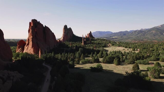 Flying Over Pines Garden of the Gods west side 4K features a view from a drone of the west side of Garden of the Gods in Colorado Springs at sunrise.