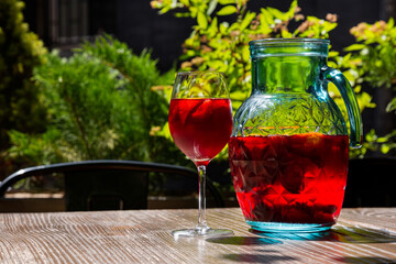 Juice with oranges and strawberries in a glass