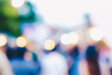 Abstrack blurred bokeh group of people walking on outdoor market festival