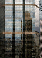 Fototapeta na wymiar Sky and buidings reflection on Glass wall of building with repeating structure. Exterior architecture of modern building, View from the outside, Copy space, No focus, specifically..