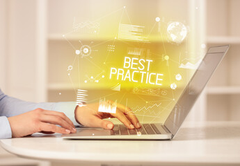 Side view of a business person working on laptop
