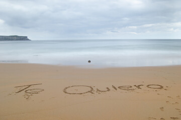 I love you written on the sand of the beach