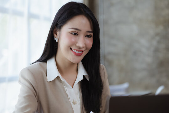 Beautiful Asian woman running a company, businesswoman who founded a new generation of startup companies, management run by female leaders, female bosses. Business administration concept.