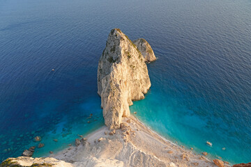 Large rock island in the sea, clear blue water. Zante, Greece 