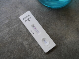 Close-up of Antigen test kit showing results of testing for COVID-19 test result is positive Alcohol and testing equipment It is an image element suitable for illustrating COVID-19 news.