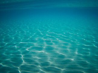 Fototapeta na wymiar sea bottom with blue water