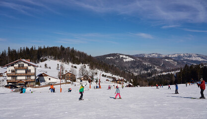 Skiing on slope in european Bialy Krzyz in Poland