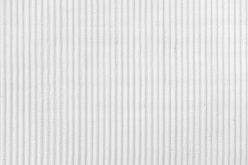 White grey painted wall with vertical lines. Cement textured background. 