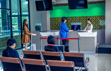 Travellers  check in at airport check in counter at Don Muang international airport, airline business