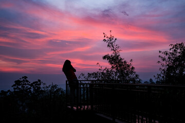 Fototapeta na wymiar silhouette of a person on a sunrise