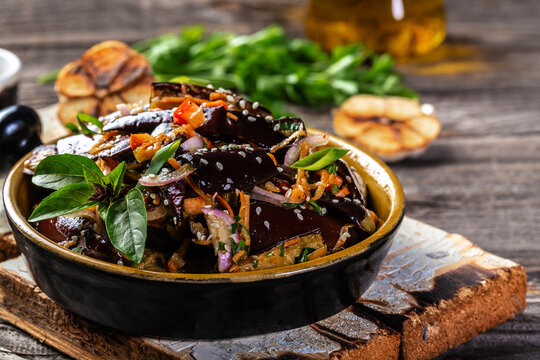 eggplant salad. Hot spicy stewed eggplant in Korean, with tomatoes, paprika, carrot, onion and garlic. Vegan food