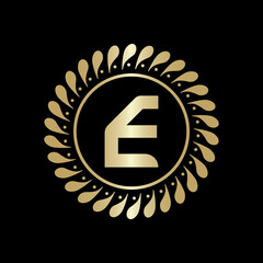  Initial E Golden leaf and circle logo design vector. Golden beauty E Logo and business symbol and alphabets vector design