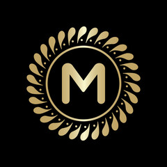  Initial M Golden leaf and circle logo design vector. Golden beauty M Logo and business symbol and alphabets vector design