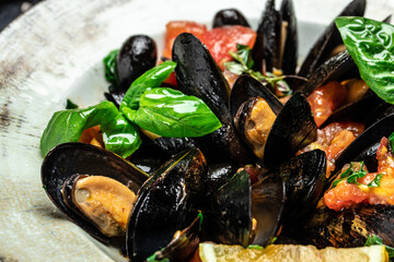 dish of mussels with lemon and baguette. Clams in the shells. Restaurant menu, dieting, cookbook recipe top view