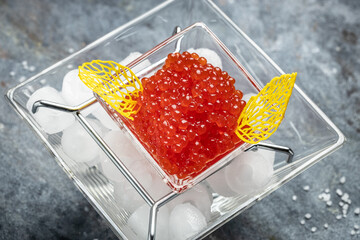 Delicious red caviar in bowl, Close-up salmon caviar. Delicatessen. Gourmet food. Seafood. appetizer, selective focus, place for text,