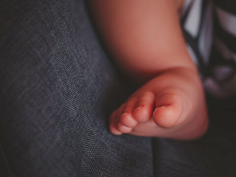 tiny baby feet closeup.Beautiful conceptual image of maternity.