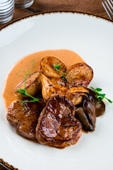 medallions of beef with baked mini potatoes with mushrooms