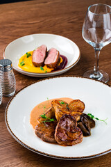 medallions of beef with baked mini potatoes with mushrooms