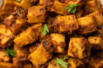 Stir fried taro roots. Arbi ki sabji, ghuiya masala curry Sabzi or arvi dum Masala. Garnished with coriander