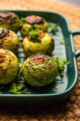 Indian style Tinda or Tinde ki Sabzi also called Indian squash, round melon, Indian round gourd or Indian baby pumpkin, stuffed, stir fried dry or curry recipe