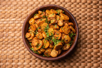Stir fried taro roots. Arbi ki sabji, ghuiya masala curry Sabzi or arvi dum Masala. Garnished with coriander - obrazy, fototapety, plakaty