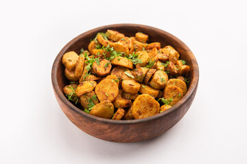 Stir fried taro roots. Arbi ki sabji, ghuiya masala curry Sabzi or arvi dum Masala. Garnished with coriander