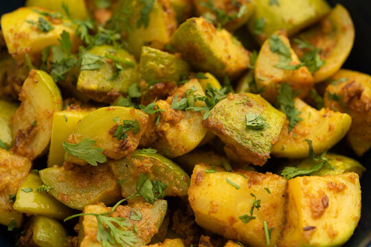 Indian style Tinda or Tinde ki Sabzi also called Indian squash, round melon, Indian round gourd or Indian baby pumpkin, stuffed, stir fried dry or curry recipe