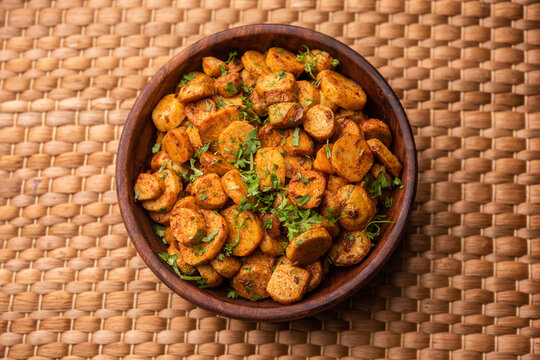 Stir fried taro roots. Arbi ki sabji, ghuiya masala curry Sabzi or arvi dum Masala. Garnished with coriander
