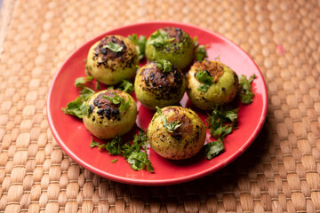 Indian style Tinda or Tinde ki Sabzi also called Indian squash, round melon, Indian round gourd or Indian baby pumpkin, stuffed, stir fried dry or curry recipe