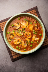 Mushroom and Pea Curry with Roasted Garlic, Indian food served in a bowl