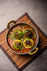 Indian style Tinda or Tinde ki Sabzi also called Indian squash, round melon, Indian round gourd or Indian baby pumpkin, stuffed, stir fried dry or curry recipe