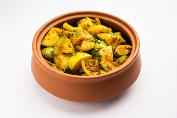 Indian style Tinda or Tinde ki Sabzi also called Indian squash, round melon, Indian round gourd or Indian baby pumpkin, stuffed, stir fried dry or curry recipe