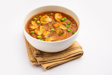 Mushroom and Pea Curry with Roasted Garlic, Indian food served in a bowl