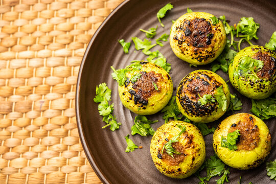 Indian style Tinda or Tinde ki Sabzi also called Indian squash, round melon, Indian round gourd or Indian baby pumpkin, stuffed, stir fried dry or curry recipe