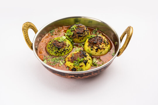 Indian style Tinda or Tinde ki Sabzi also called Indian squash, round melon, Indian round gourd or Indian baby pumpkin, stuffed, stir fried dry or curry recipe