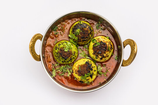 Indian style Tinda or Tinde ki Sabzi also called Indian squash, round melon, Indian round gourd or Indian baby pumpkin, stuffed, stir fried dry or curry recipe